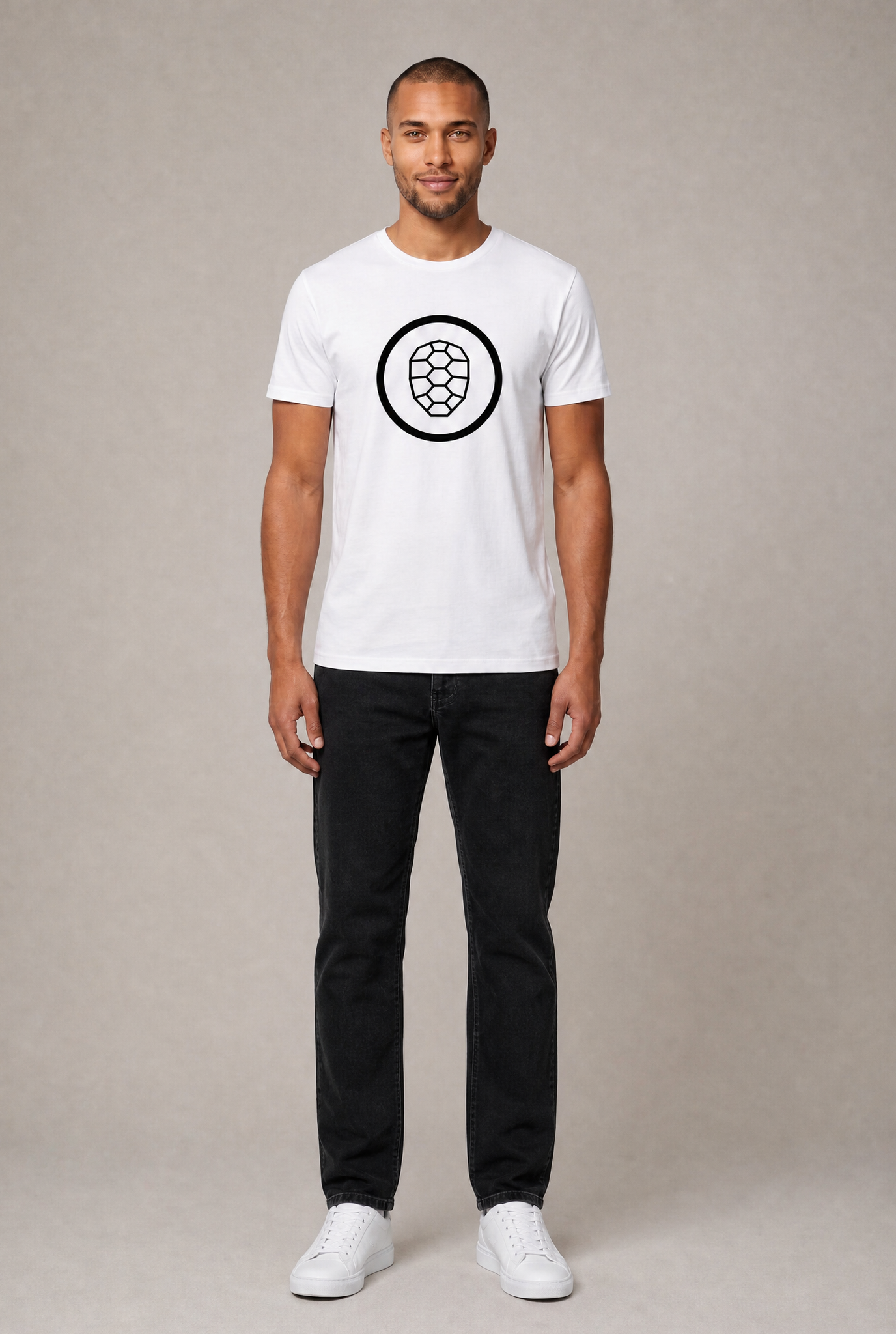 Noah wearing a white ONETURTLE t-shirt with black logo and black jeans, full-body studio photo for the t-shirts category
