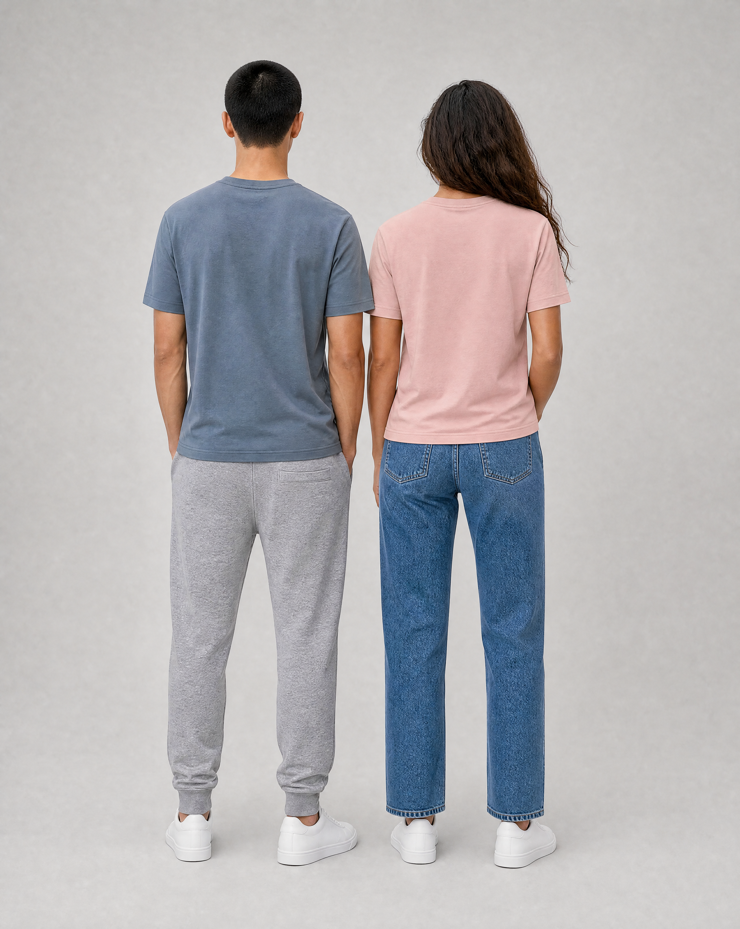 Vera and Jun wearing the unisex EcoWave 2.0 t-shirt in pearl rose and mineral grey, back view