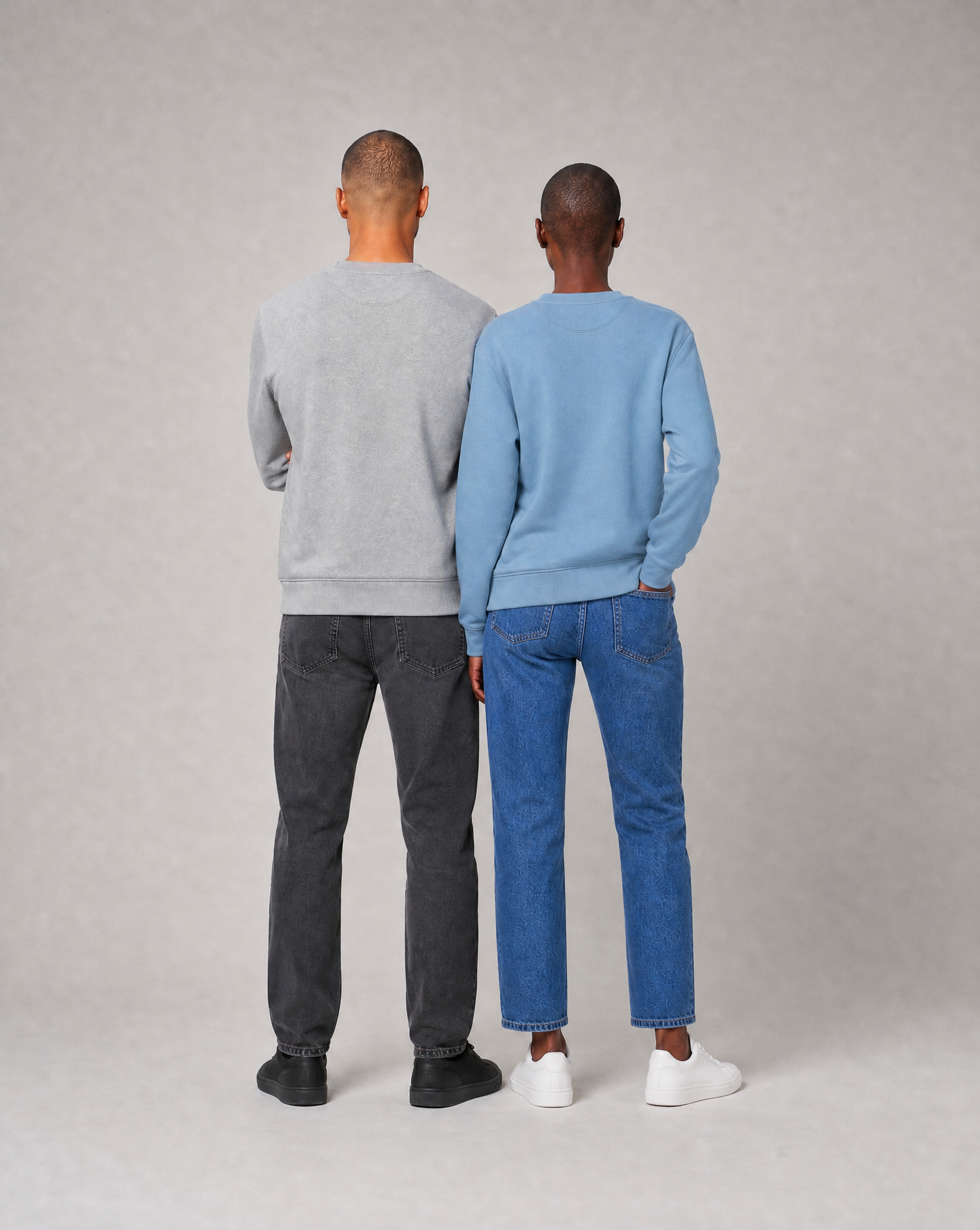 Mia and Noah wearing the unisex PlanetAir sweatshirt in aquamarine and heather grey, back view